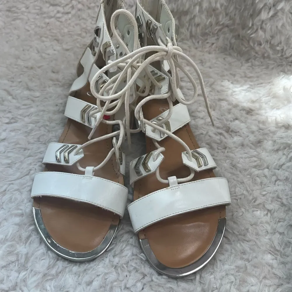 Fergie gladiator synthetic white lace up sandals with silver tone accents SZ 10